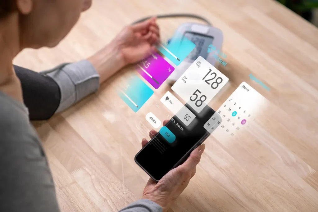Person using digital health app on smartphone with holographic blood pressure monitor and medical data interface.